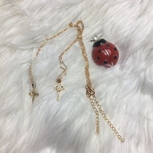 Two bejeweled cross necklaces, NWOT, 18-20” long.